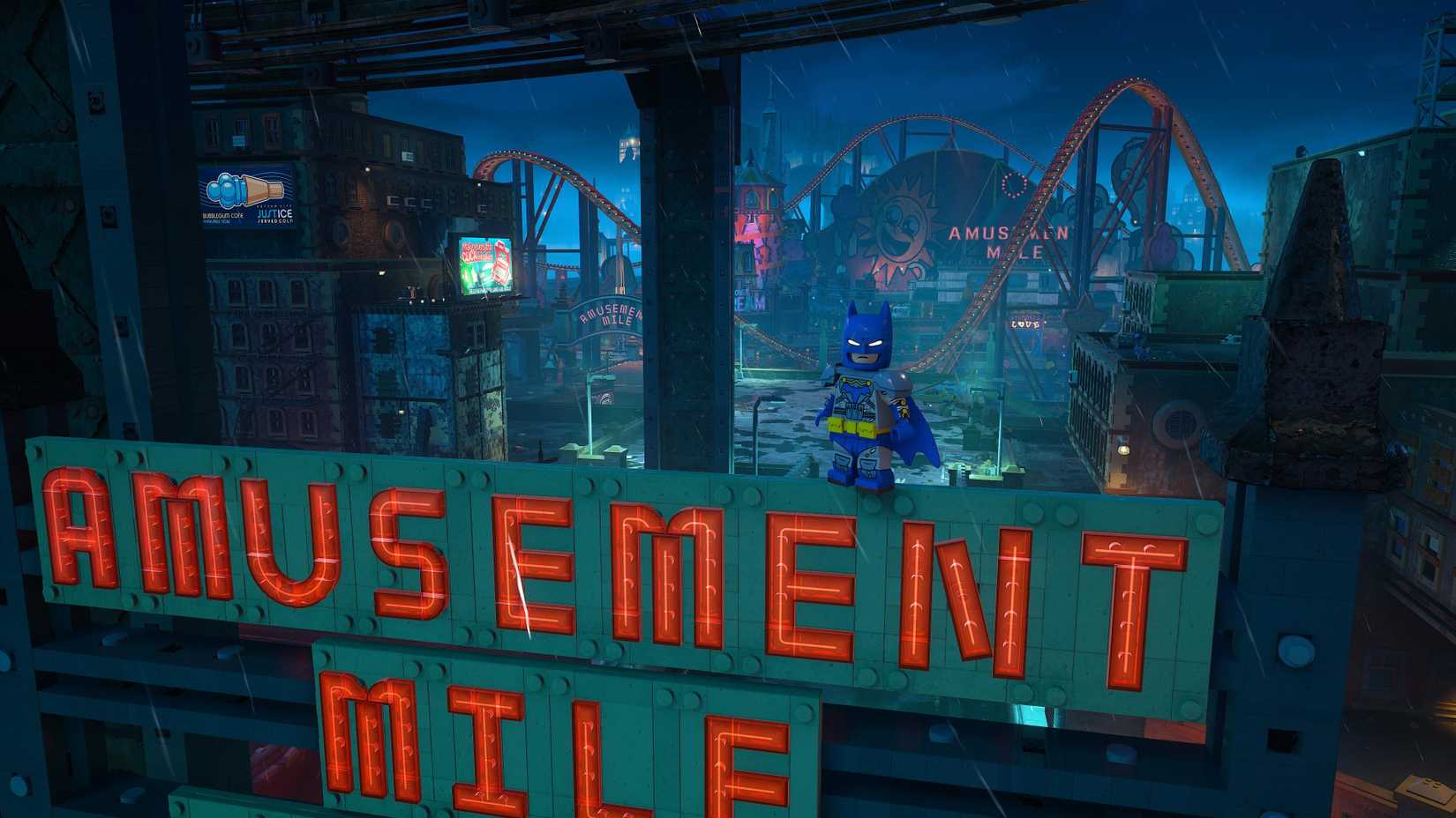 Batman on top of the Amusement Mile sign in LEGO Batman Legacy of the Dark Knight