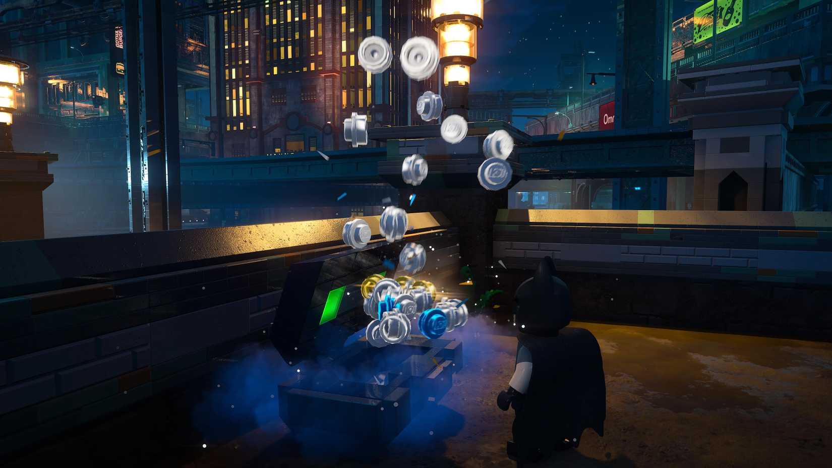 Batman opening a cache of studs in LEGO Batman Legacy of the Dark Knight