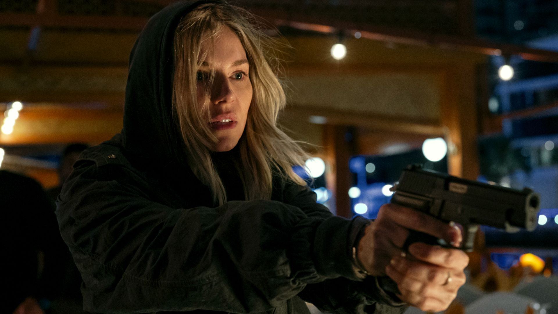 Sienna Miller holding a gun as Emma Marlow in Tom Clancy's Jack Ryan: Ghost War