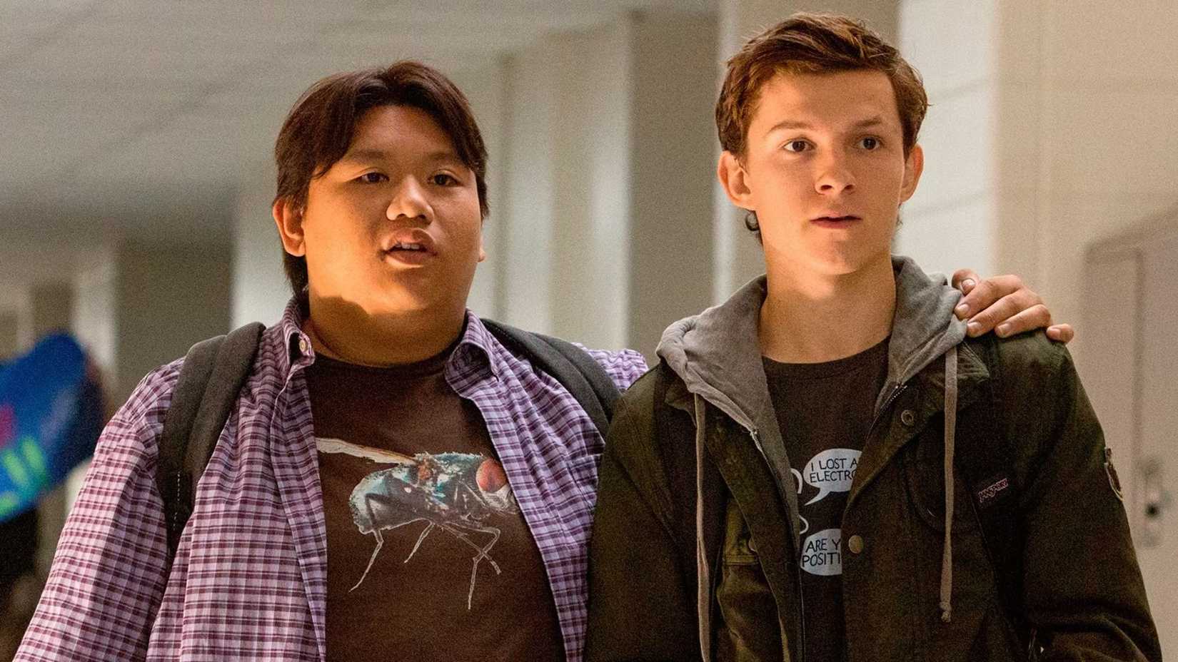 Jacob Batalon as Ned Leeds with his arm around Tom Holland as Peter Parker in Spider-Man
