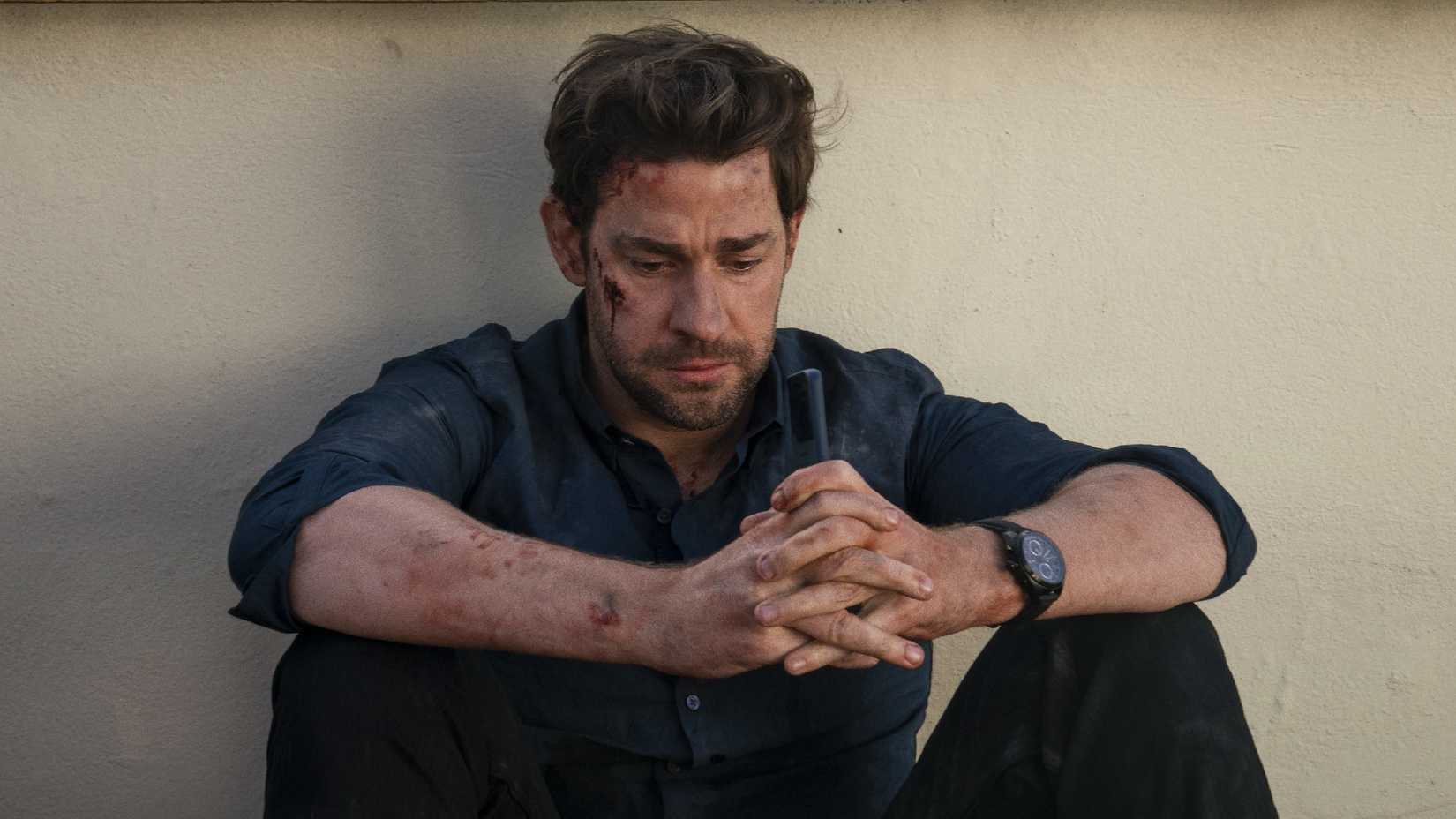 John Krasinski as Jack Ryan looking glum.