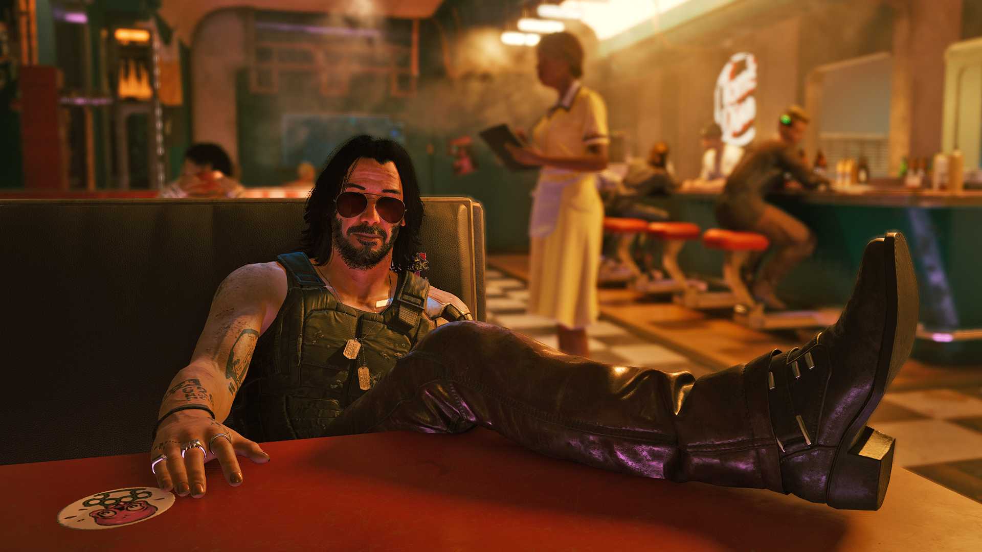 Johnny Silverhand sitting in a restaurant booth with his leg u on the table.