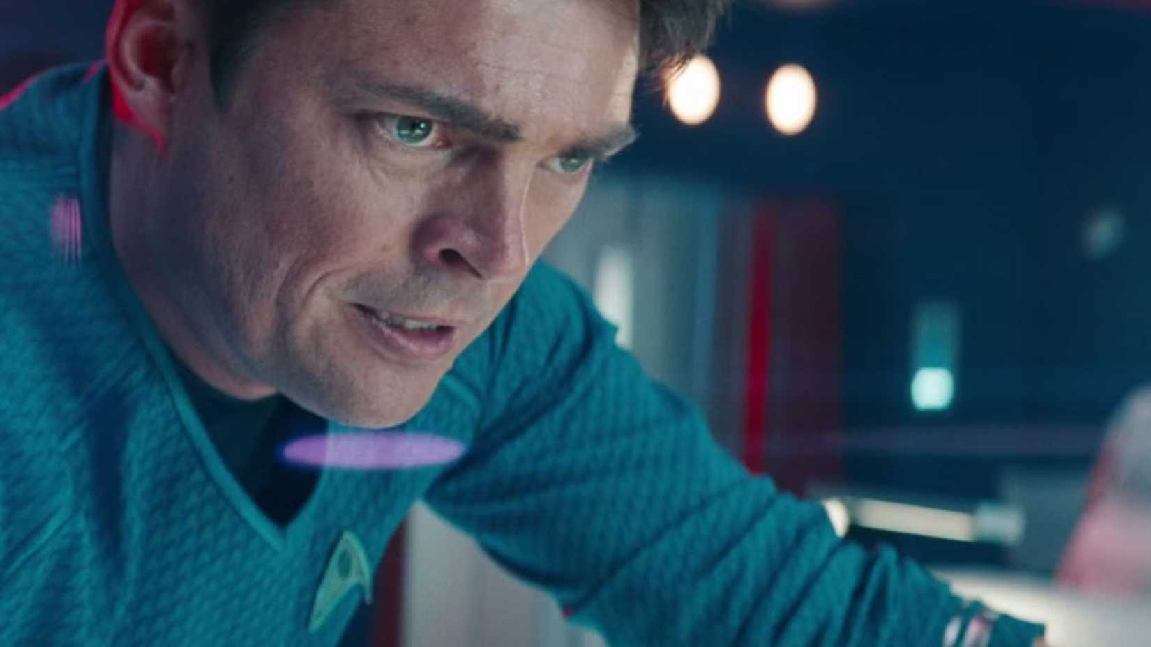 Karl Urban as Bones McCoy looking worried in Star Trek