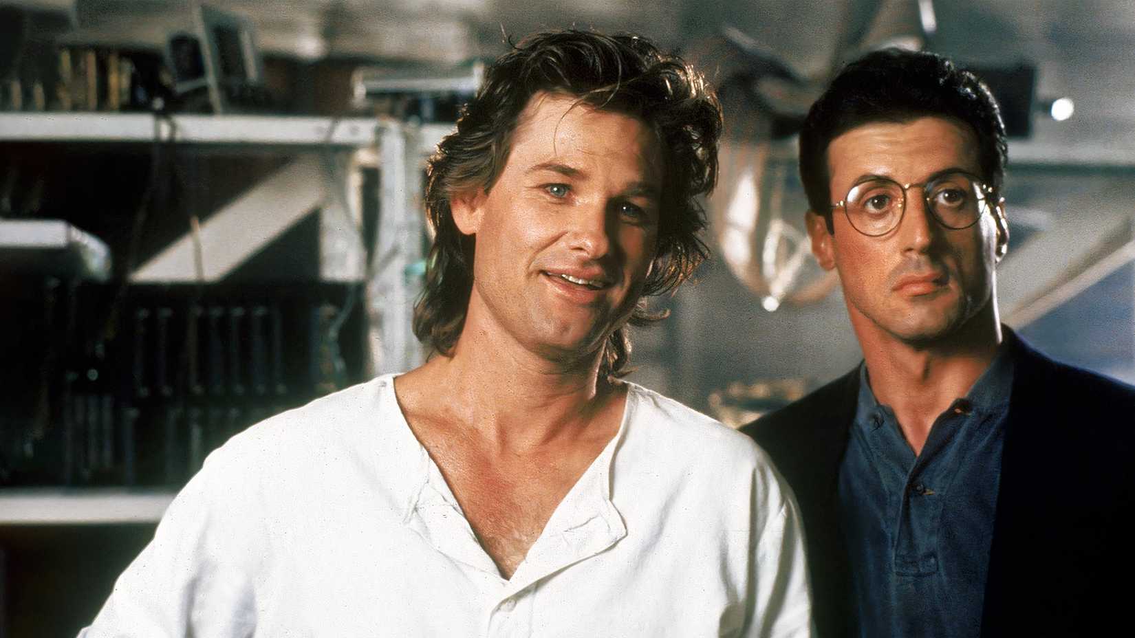 Kurt Russell smiling and Sylvester Stallone looking bemused in Tango & Cash