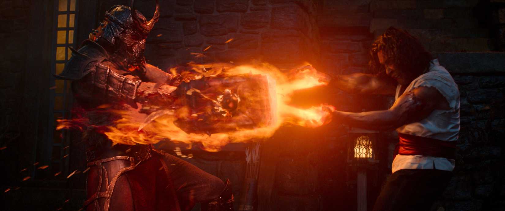 Liu Kang blasting fire at Shao Kahn's hammer in Mortal Kombat II