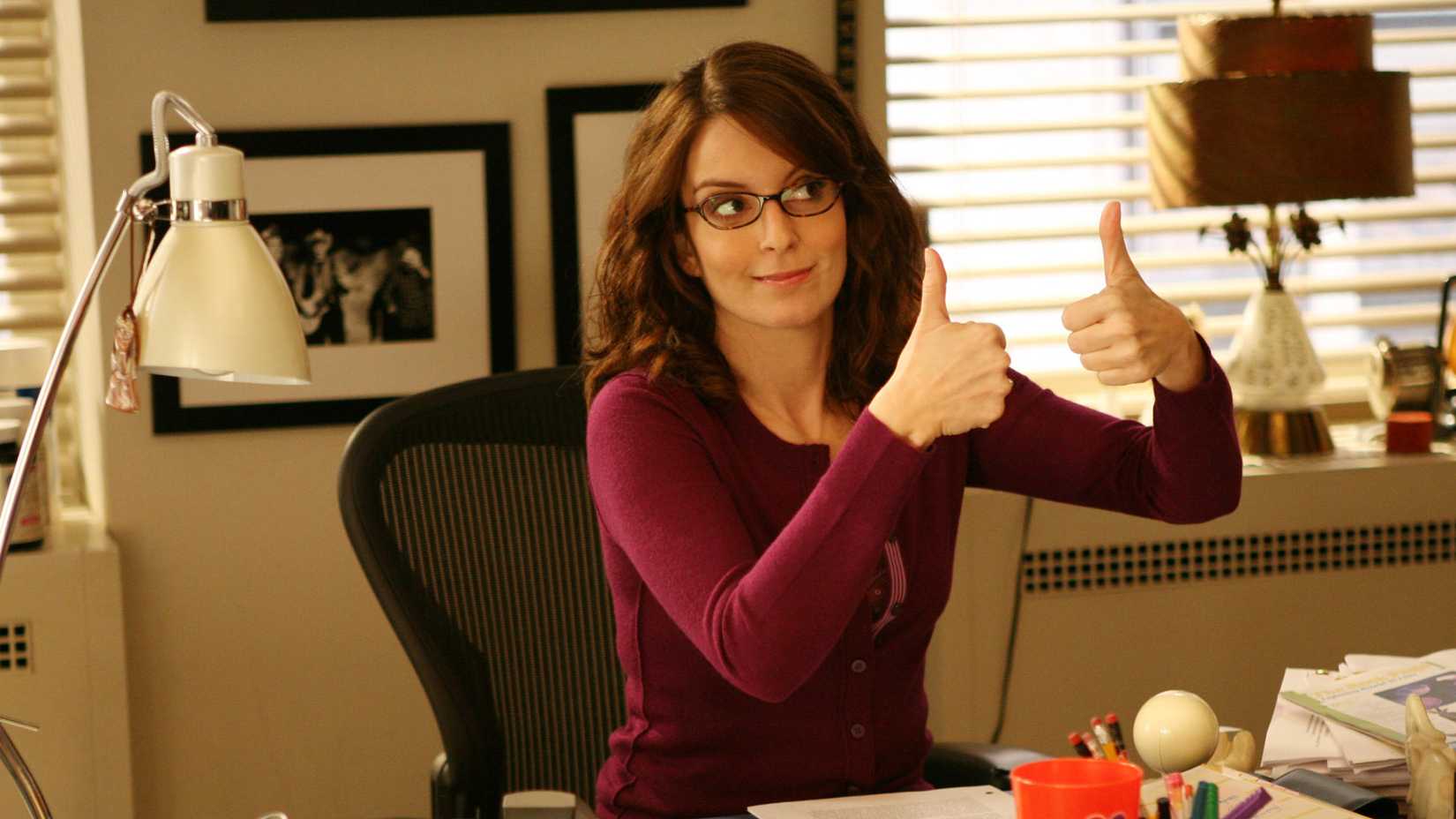 Liz giving a thumbs up at her desk in 30 Rock