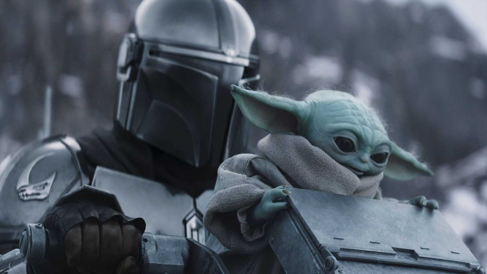 Din Djarin e Grogu em cenário nevado em The Mandalorian & Grogu