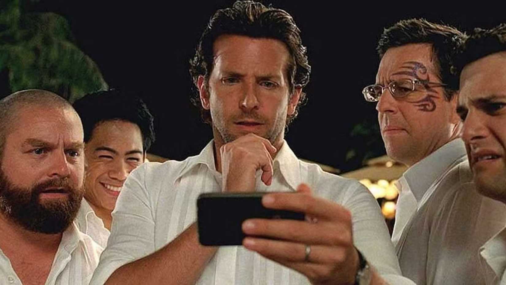 mason lee zach galifianakis bradley cooper ed helms and justin bartha in the hangover part ii looking at a phone