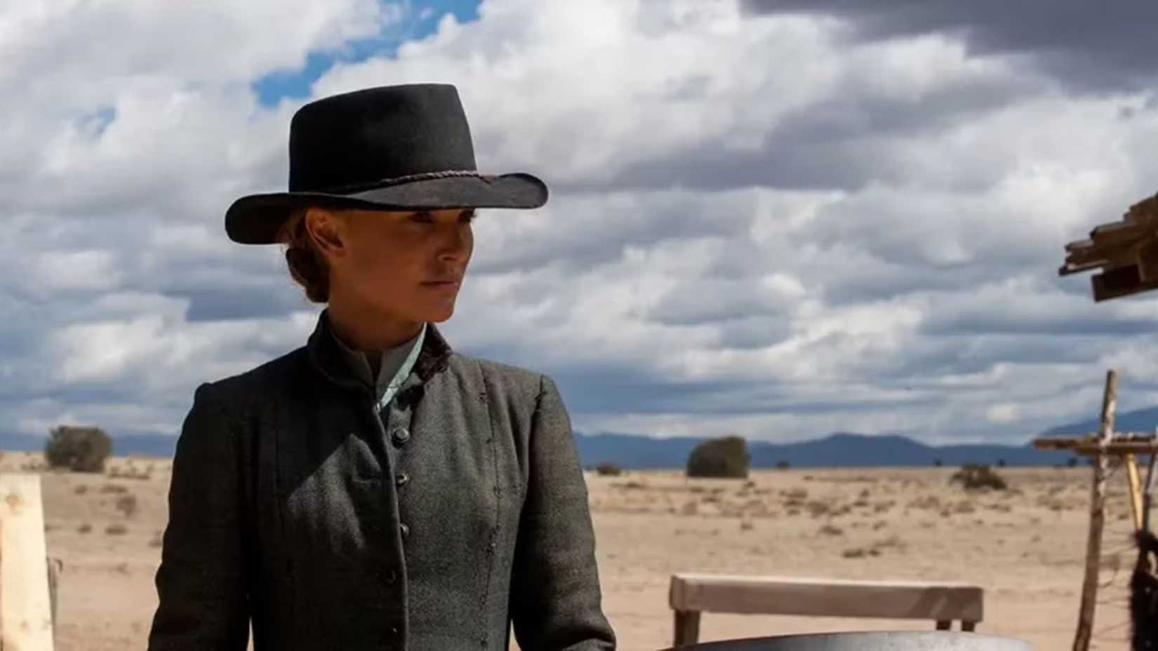 Natalie Portman as Jane standing in a corral in Jane Got A Gun
