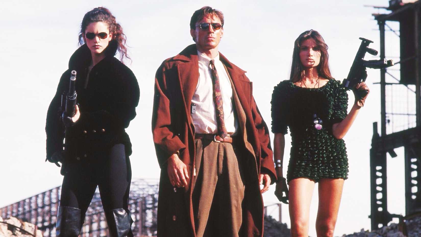 Three characters stand with guns in Nemesis