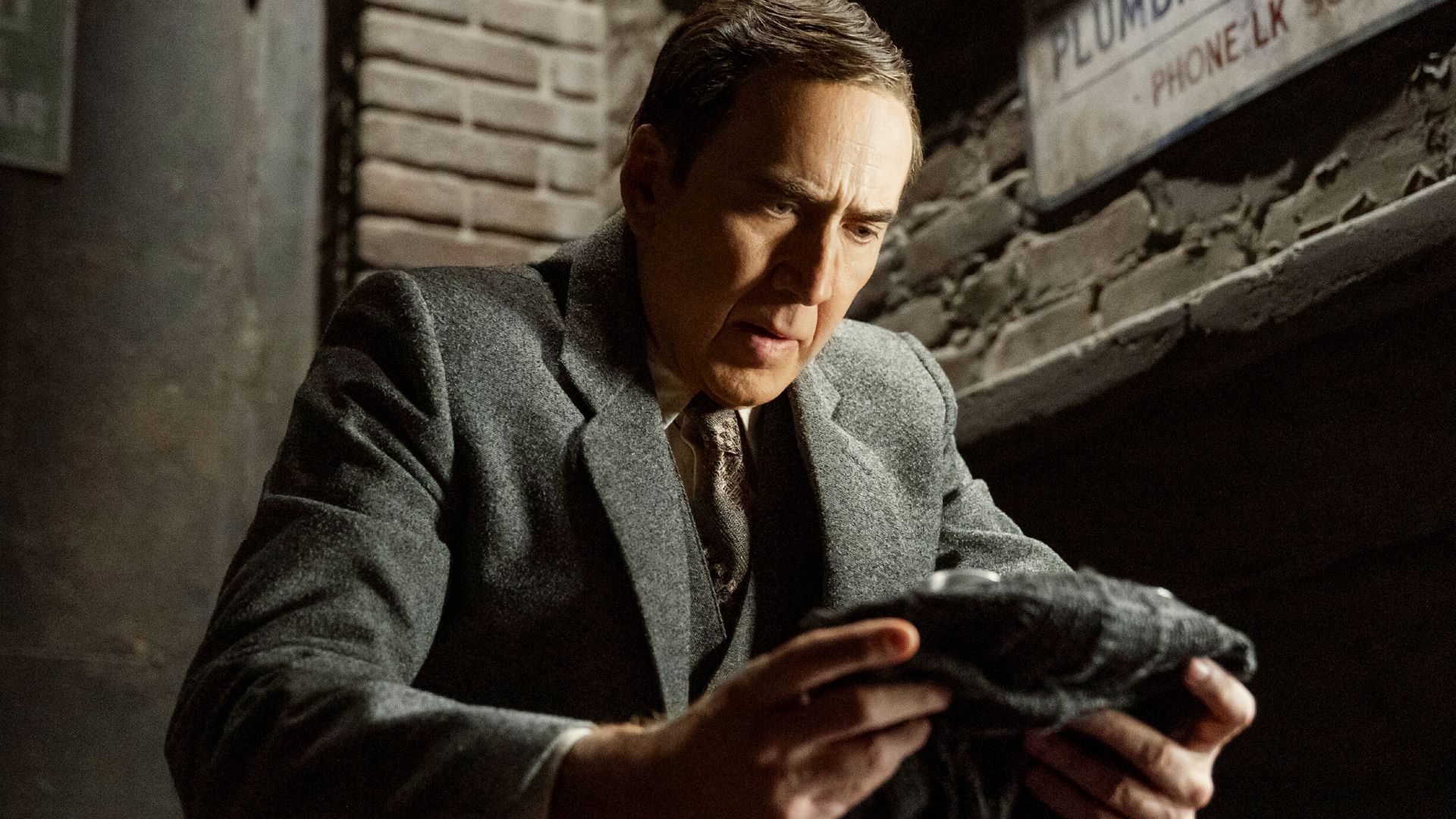 Nicolas Cage holding his Spider-Man mask in final Spider-Noir trailer