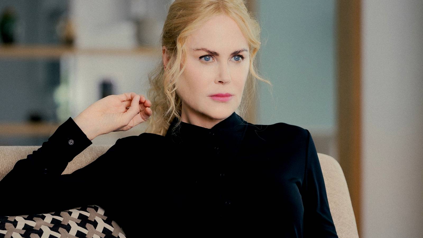 Nicole Kidman looking intense while sitting on a couch in Lioness season 2
