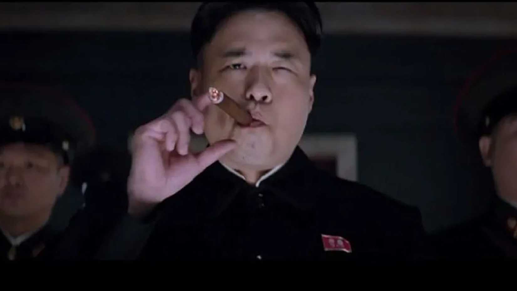 Randall Park smokes a cigar as Kim Jong Un in The Interview