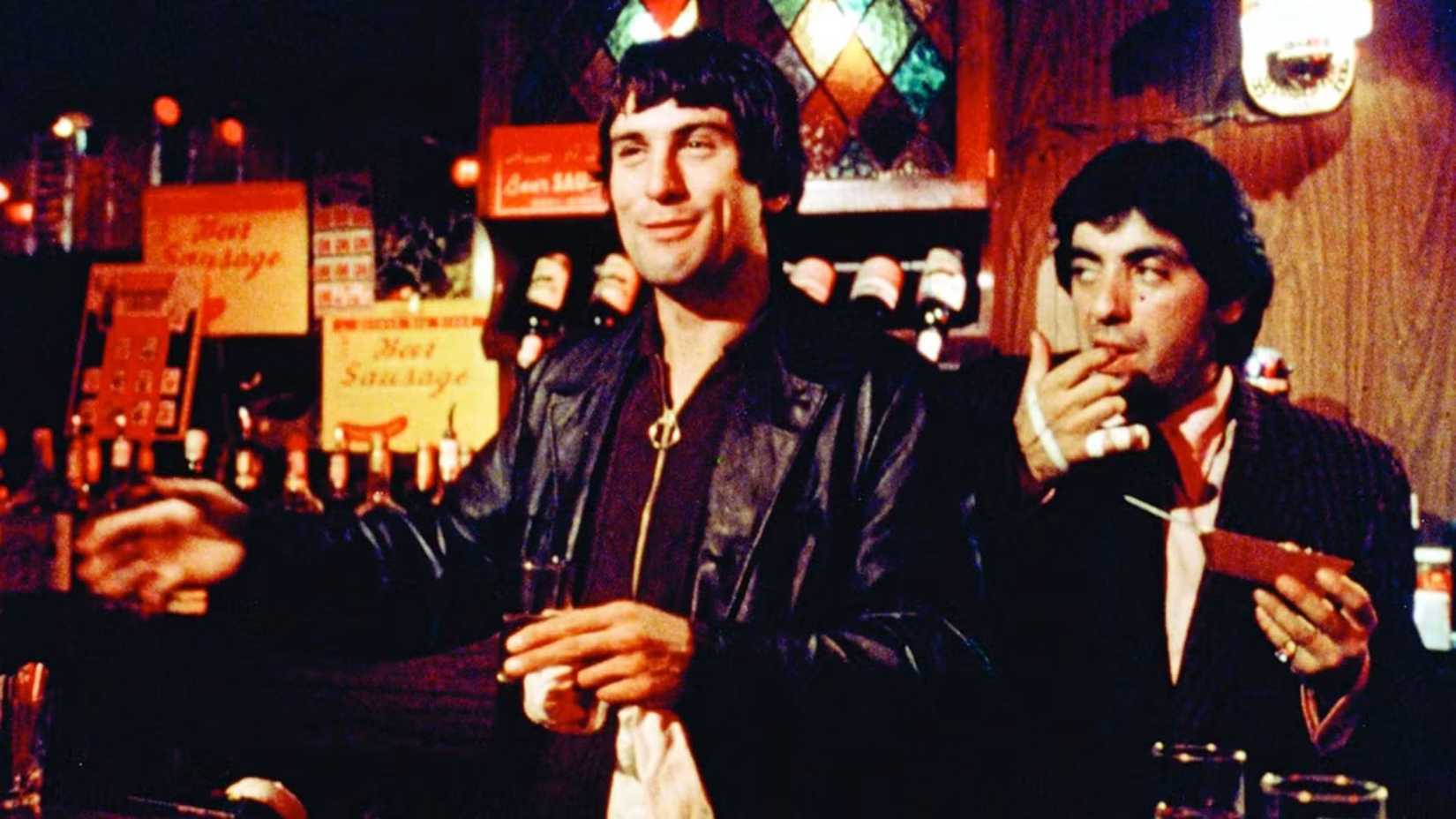 robert de niro as johnny boy grinning in a bar in mean streets
