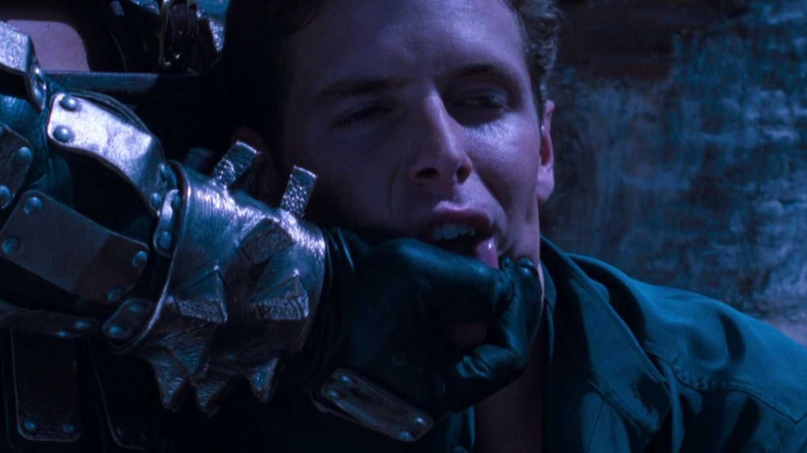 shao khan about to break johnny cages neck in mortal kombat annihilation