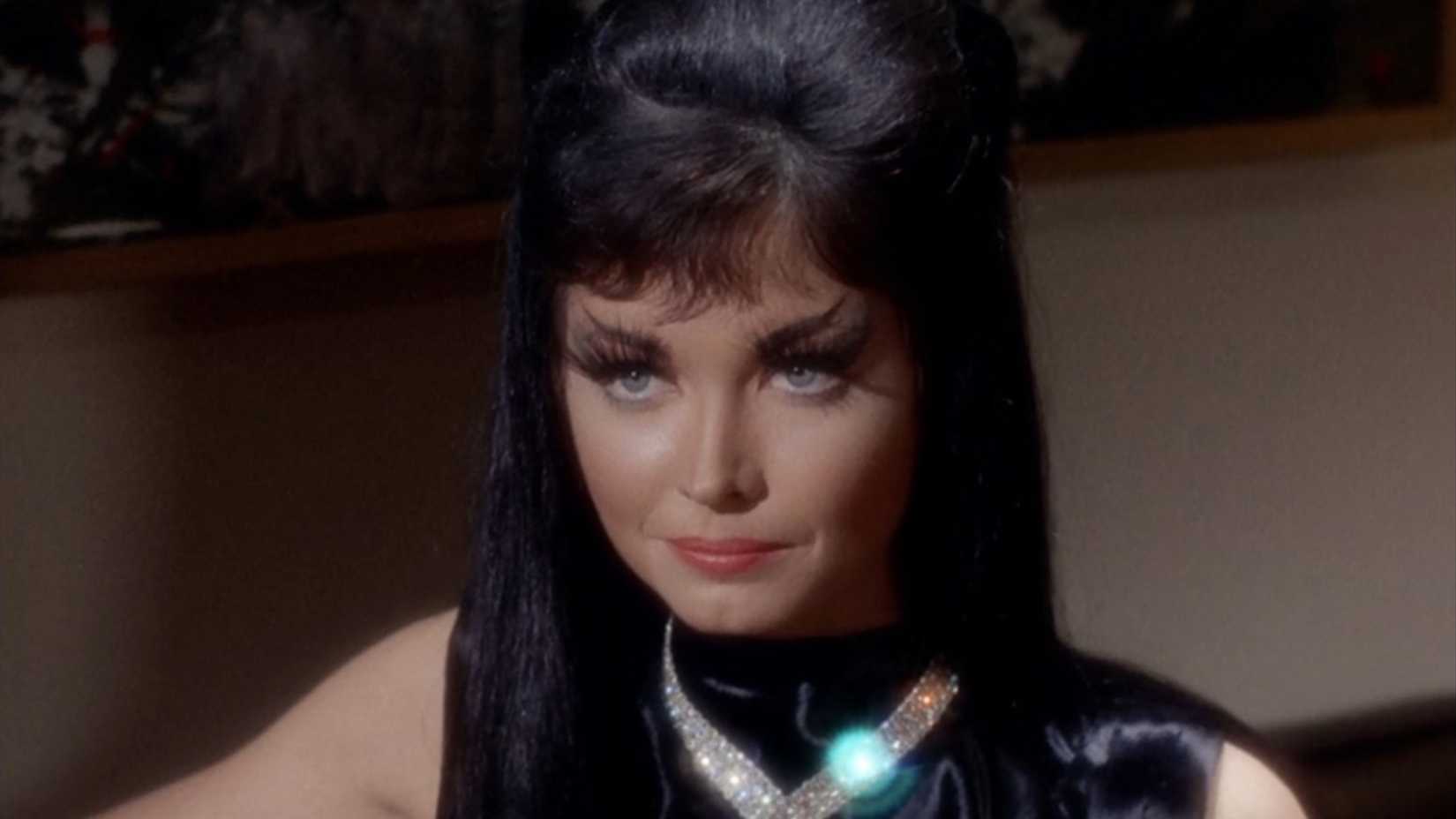 Gary Seven's cat Isis in human form, with long black hair, a diamond necklace, and looking alluring