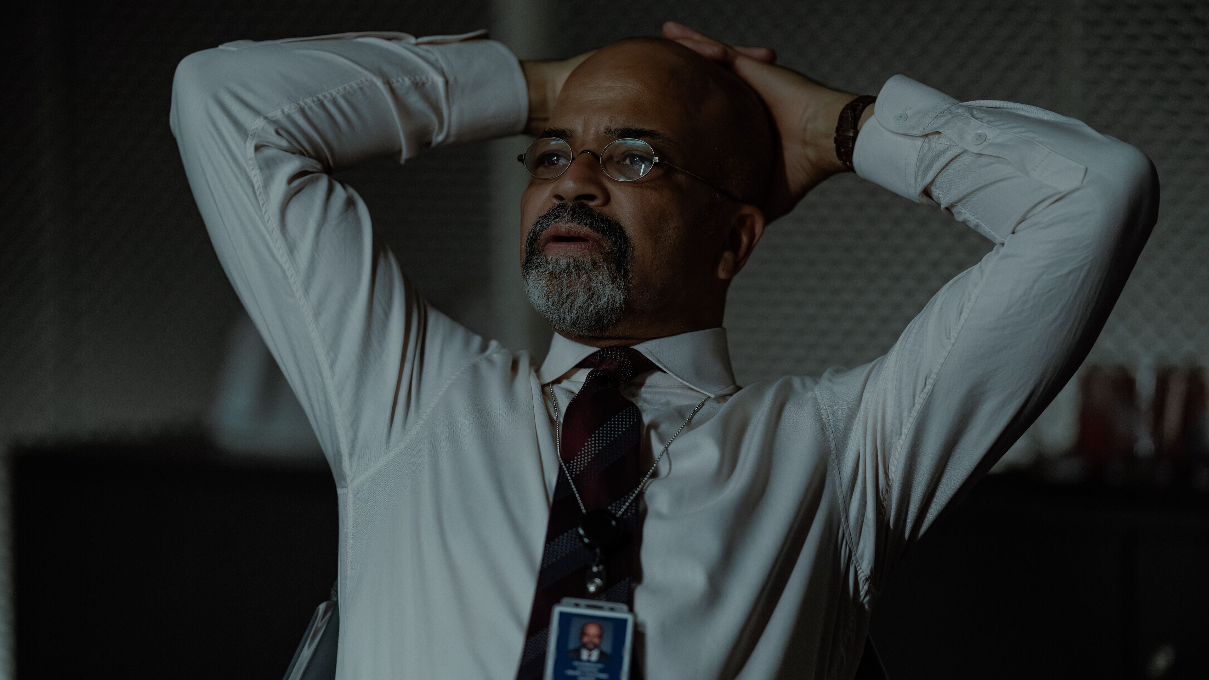 Jeffrey Wright as Henry Ogletree with his hands on his head in The Agency.
