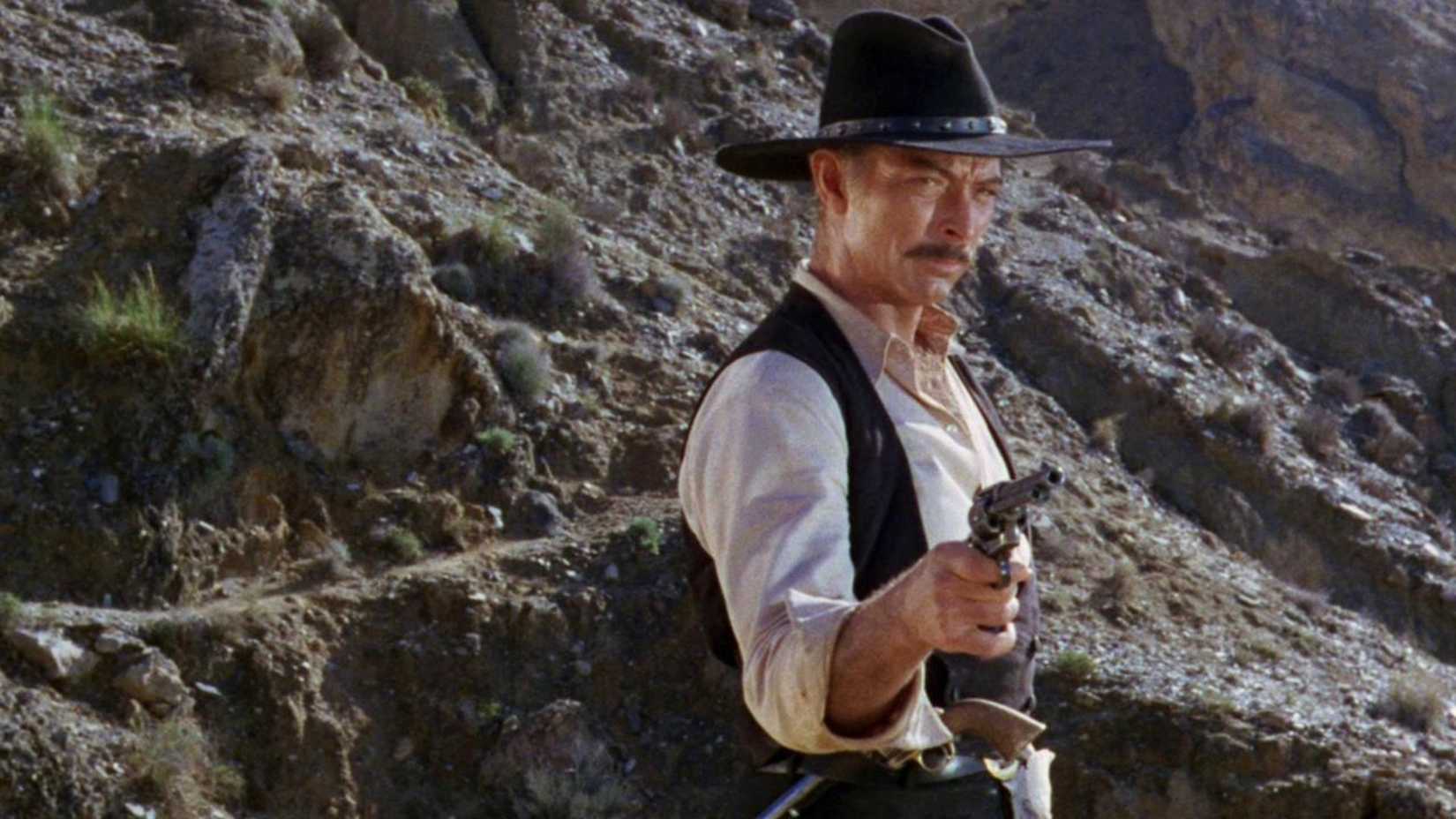 Lee Van Cleef aims his pistol in The Big Gundown