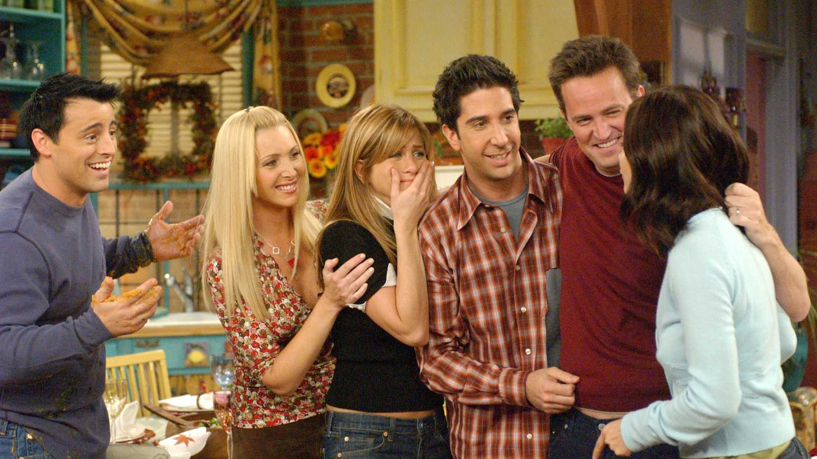 The cast of Friends all looking happy in season 10