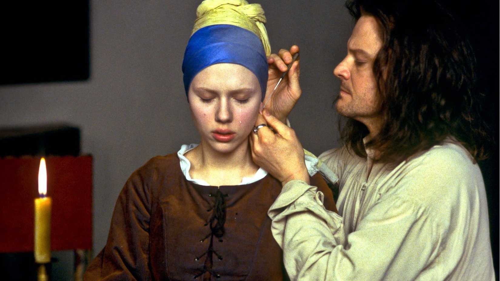 Vermeer pierces Griet's ear in The Girl with a Pearl Earring