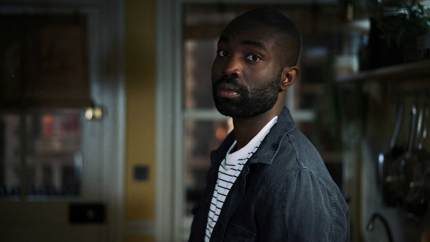 Paapa Essiedu as George Addo looking over his shoulder in The Lazarus Project.