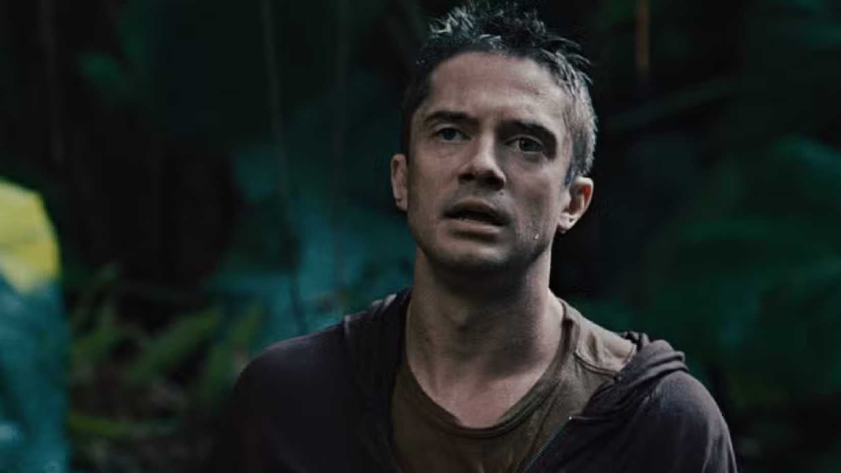Topher Grace as Edwin looks tired in Predators