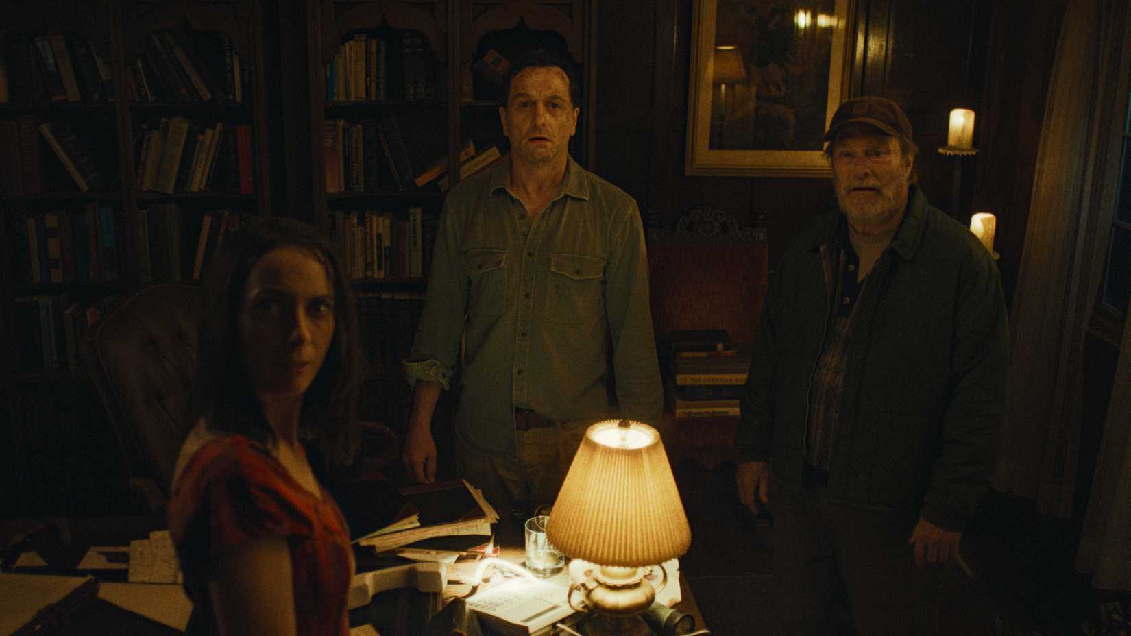 Tom, Wyck, and Patricia looking at something in terror in Widow's Bay