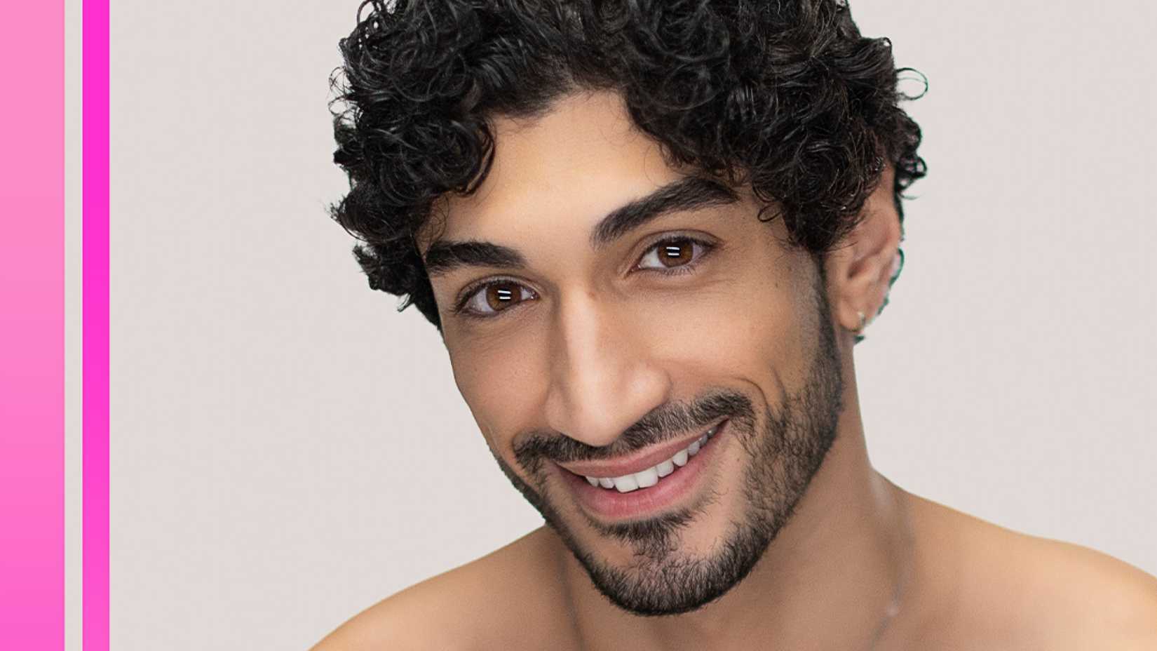 Love Island USA's Zach Georgiou smiling for a headshot with two pink stripes on the left of the image.