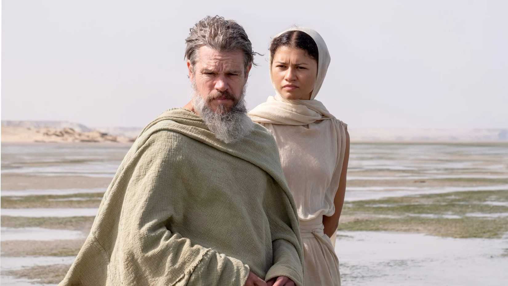 zendaya as athena standing behind matt damon in the odyssey