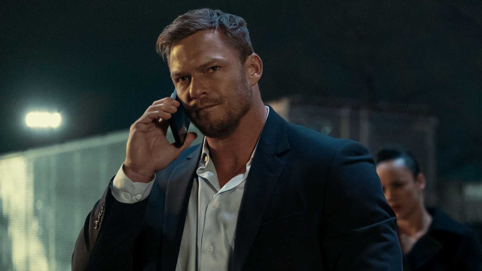 Alan Ritchson’s Jack Reacher talking on the phone in Prime Video’s Reacher