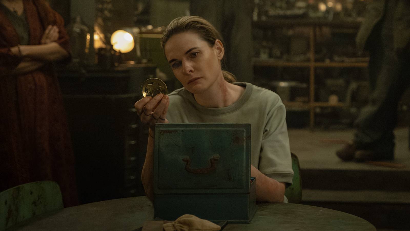 Rebecca Ferguson’s Juliette’s looking at her Sheriff’s badge in Silo season 3