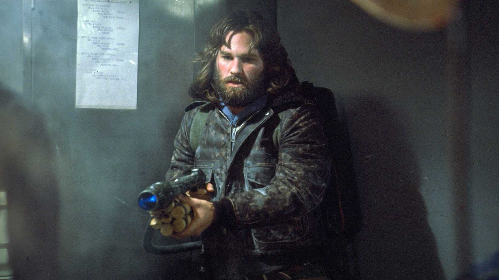 Kurt Russell’s MacReady pointing a flamethrower in John Carpenter’s The Thing