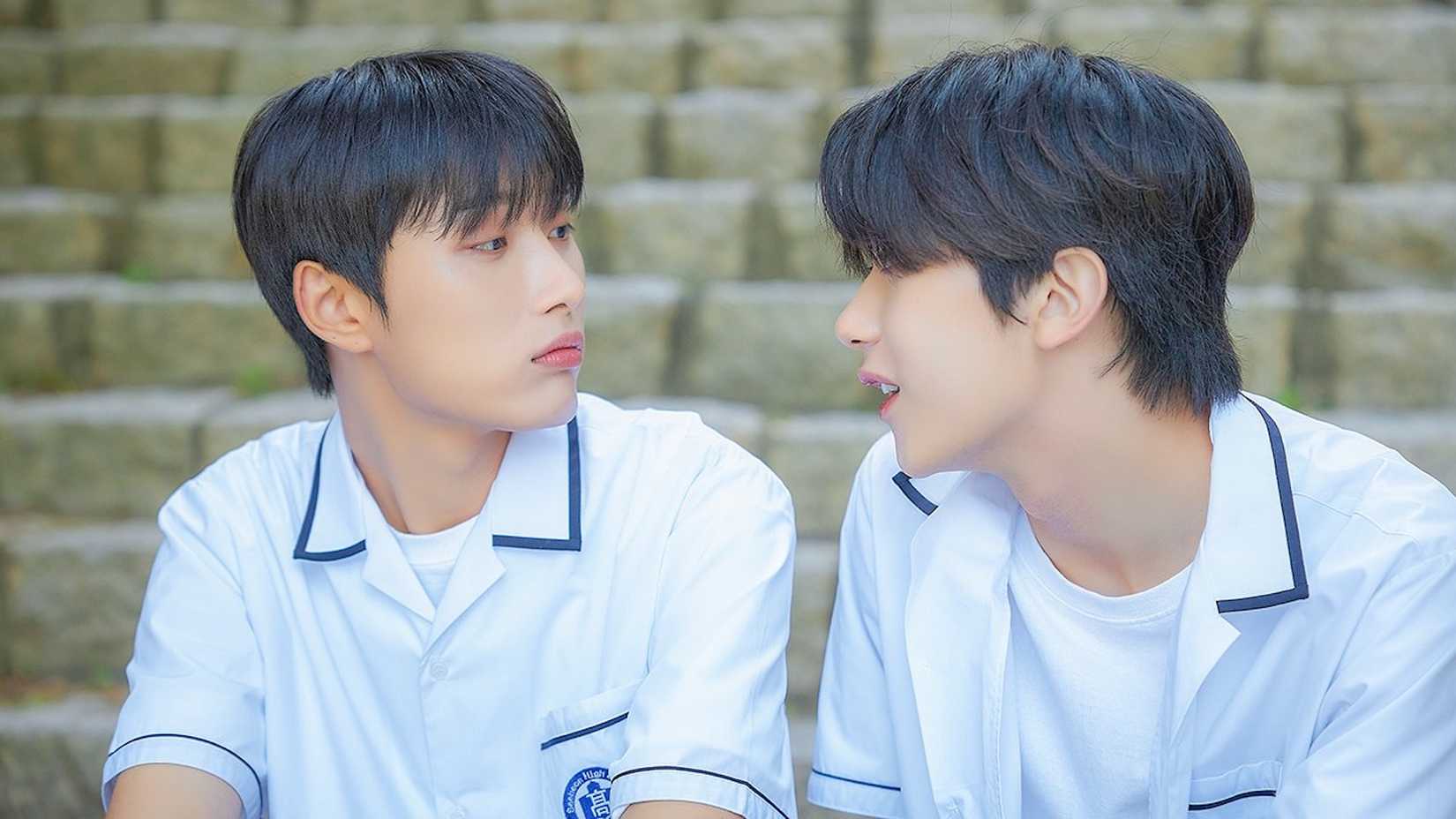 Two students chat on the stairs in the K-drama A Shoulder To Cry On.
