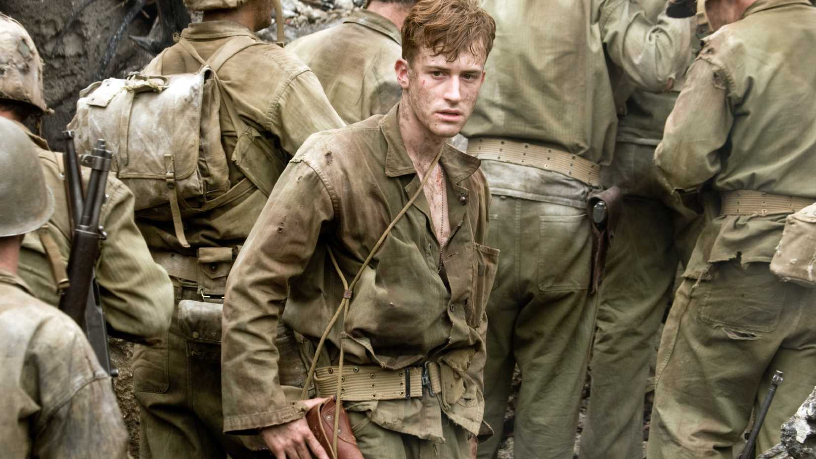 Sledge (Joseph Mazzello) looks distraught in a trench in The Pacific.
