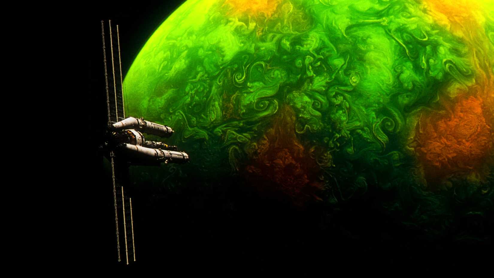 A spaceship near a green and orange planet in Project Hail Mary