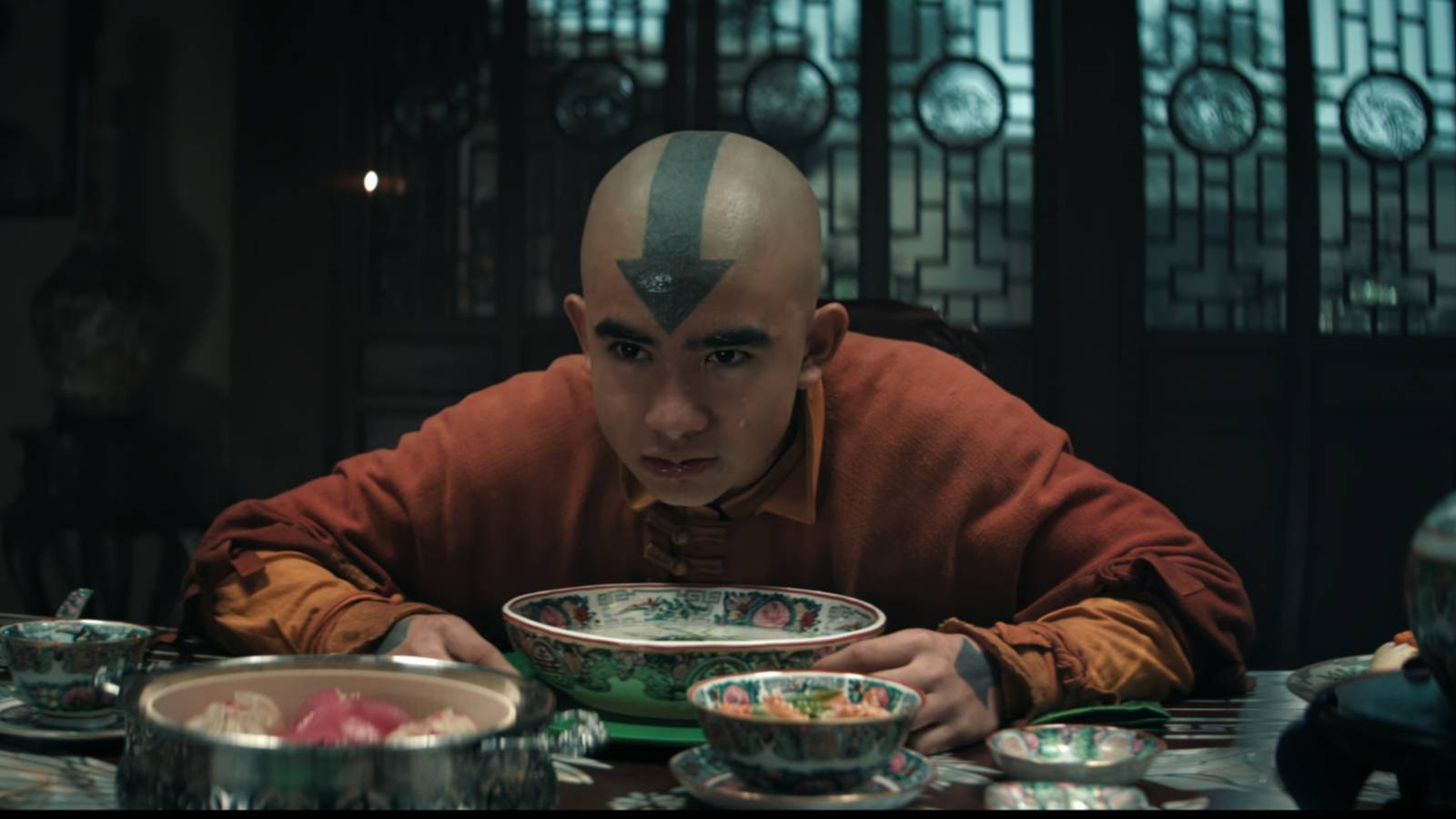 Aang looking up from his soup at Toph in Netflix's Avatar The Last Airbender