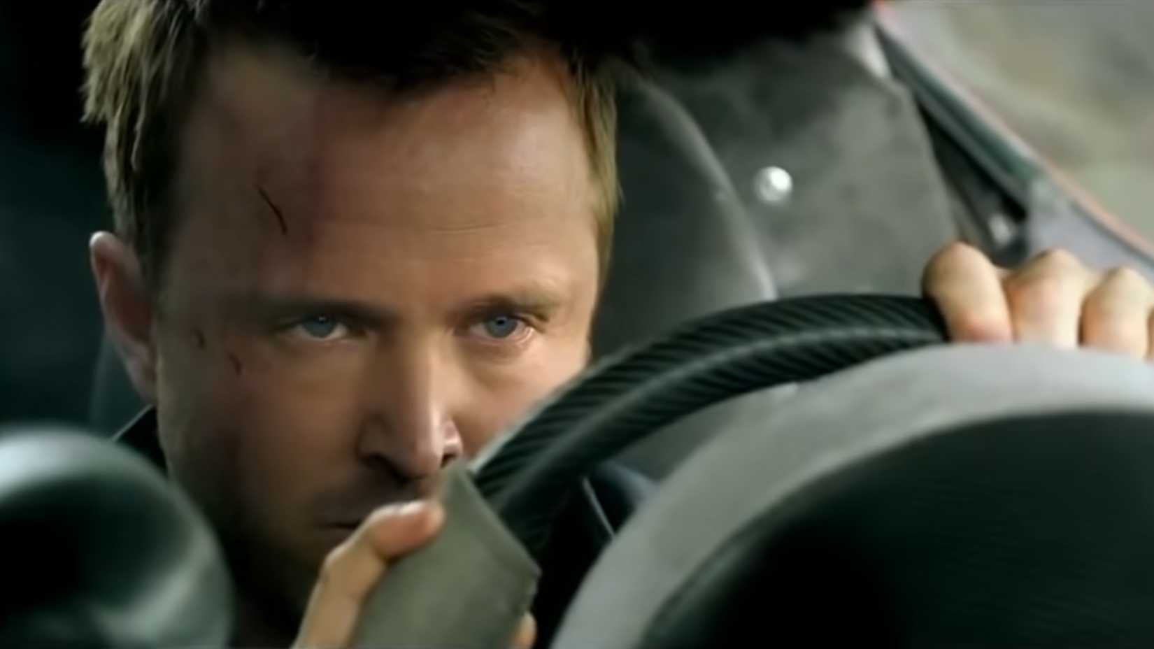Aaron Paul behind the wheel of a sports car in need for speed 2014