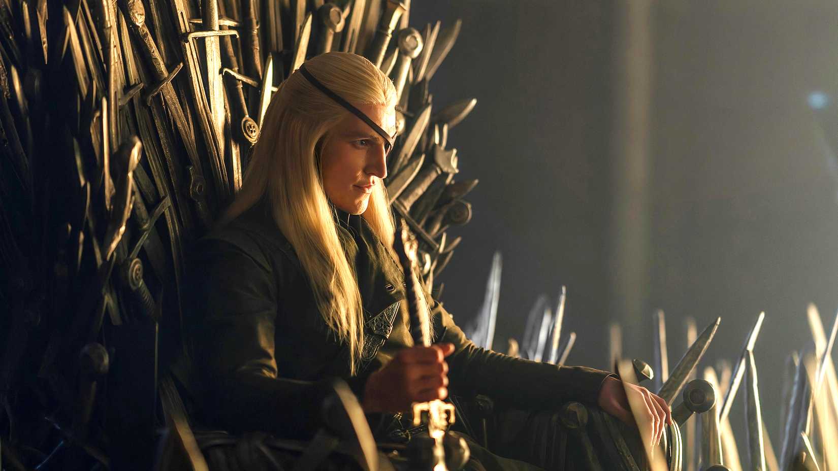 Aemond Targaryen sitting on the Iron Throne in House of the Dragon season 3