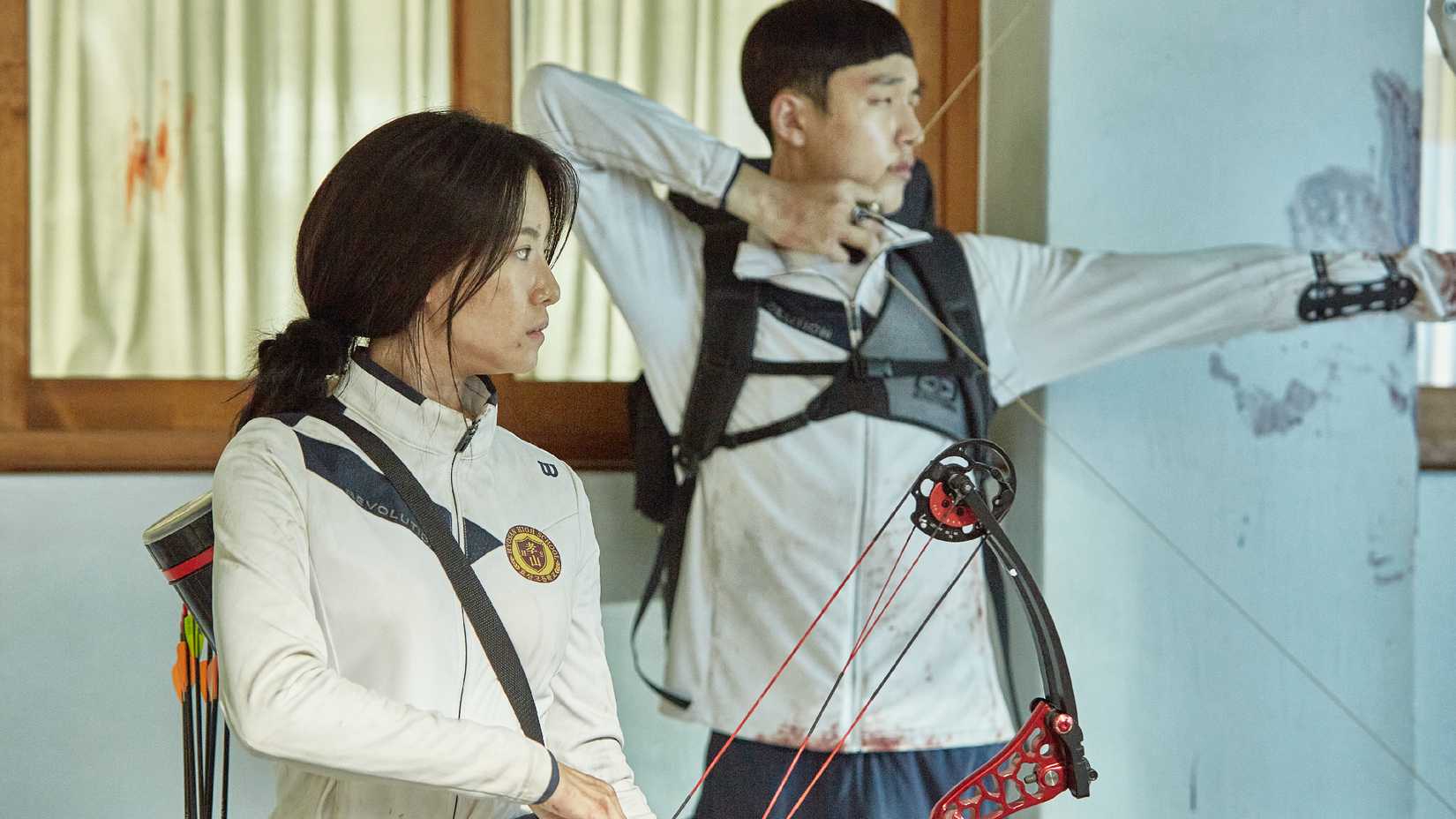 Two students practicing archery in the Netflix K-drama All of Us Are Dead.
