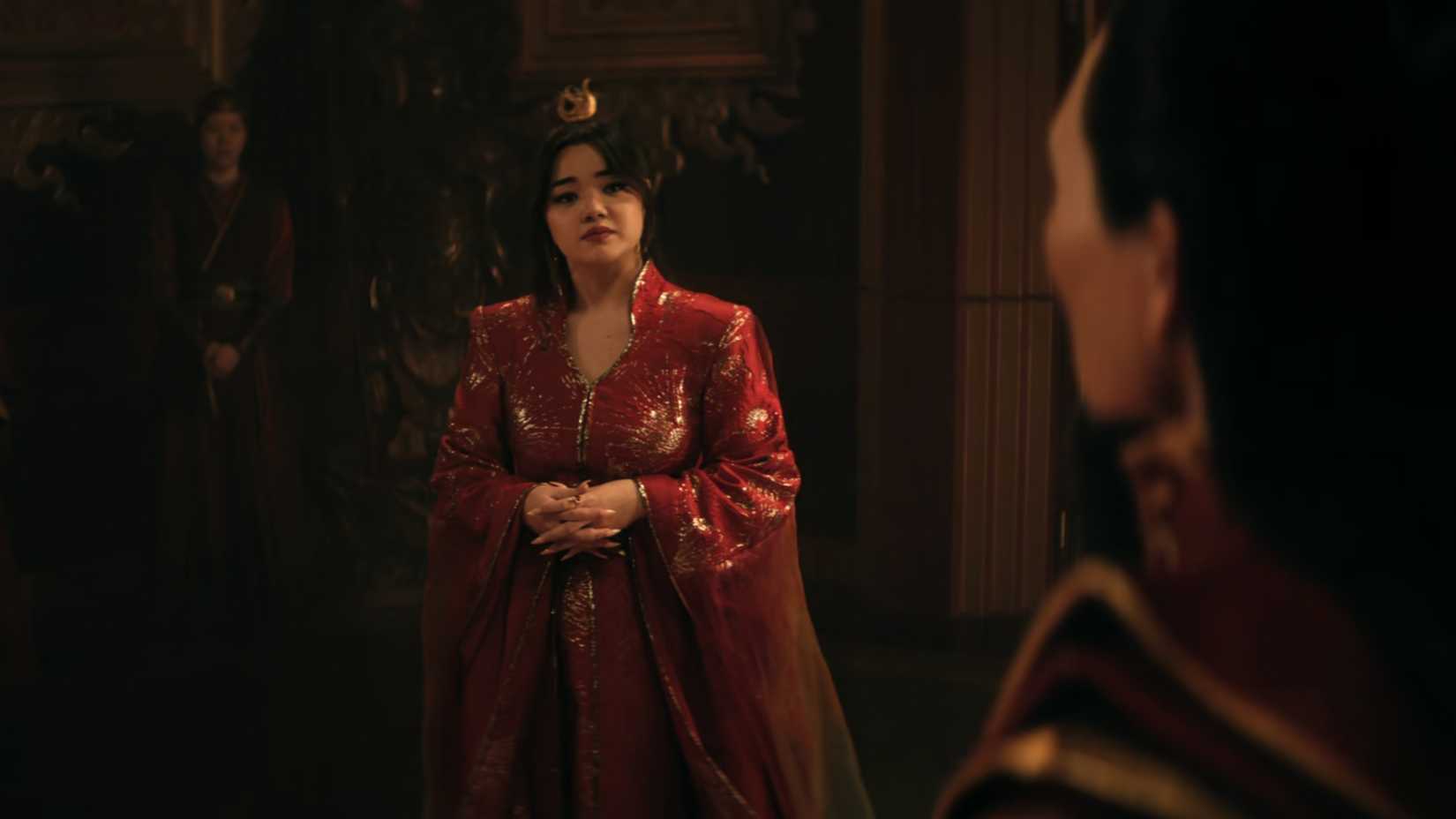 Azula looking at Ozai in a war meeting in Netflix's Avatar The Last Airbender