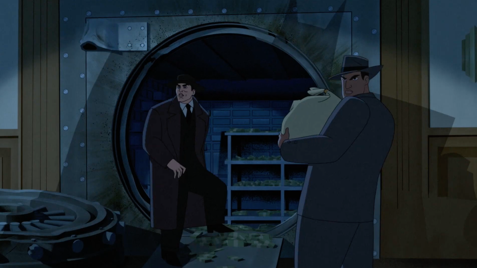 Two bank robbers next to a pried-open vault looking back as Batman's shadow is cast on them