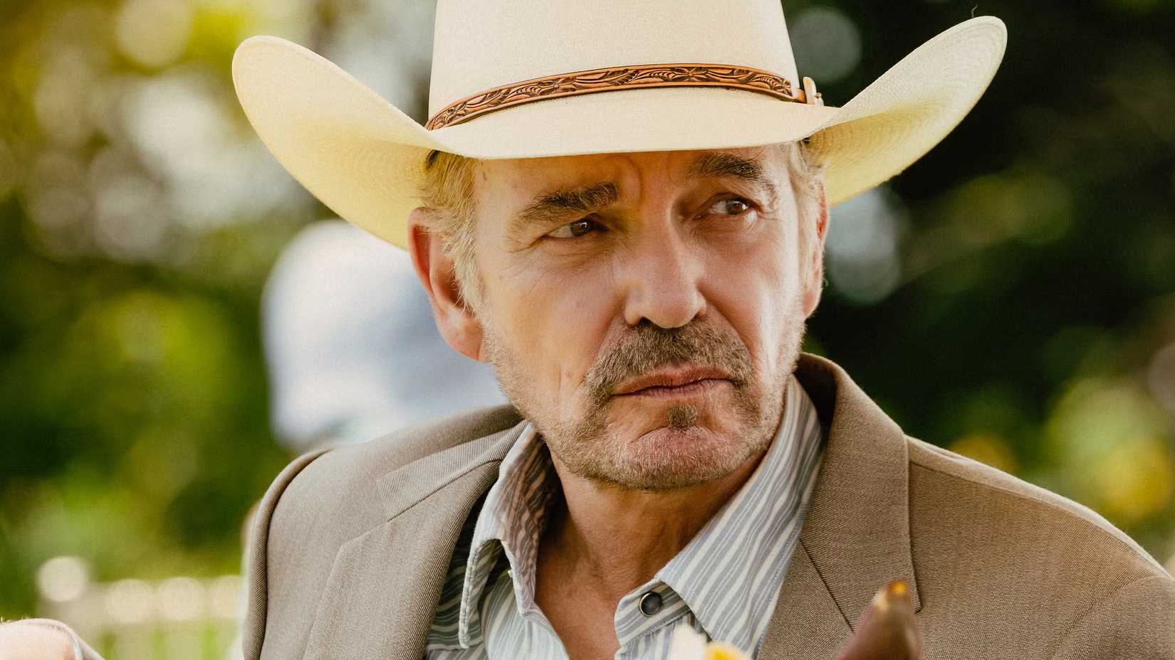 Billy Bob Thornton looking off into the distance in Landman.