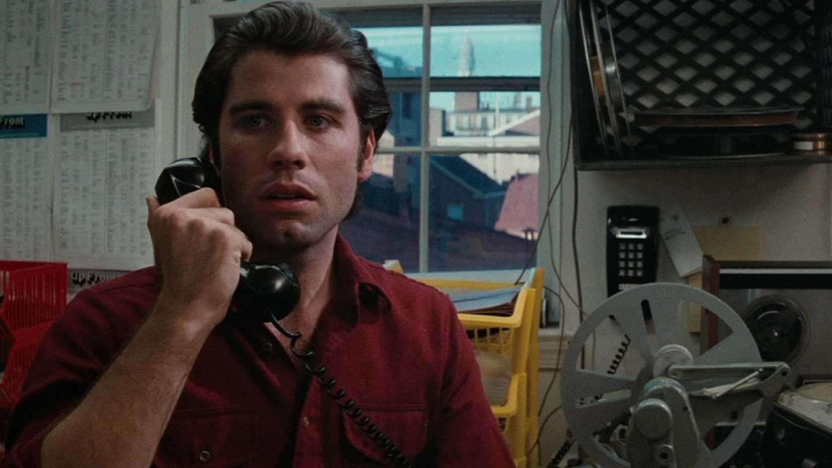 John Travolta talks on the phone in Blow Out