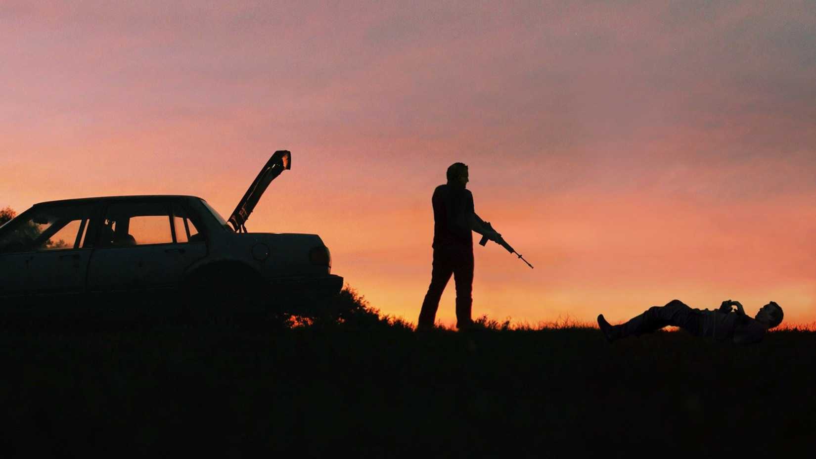 Two men framed against a pink sky in Blue Ruin
