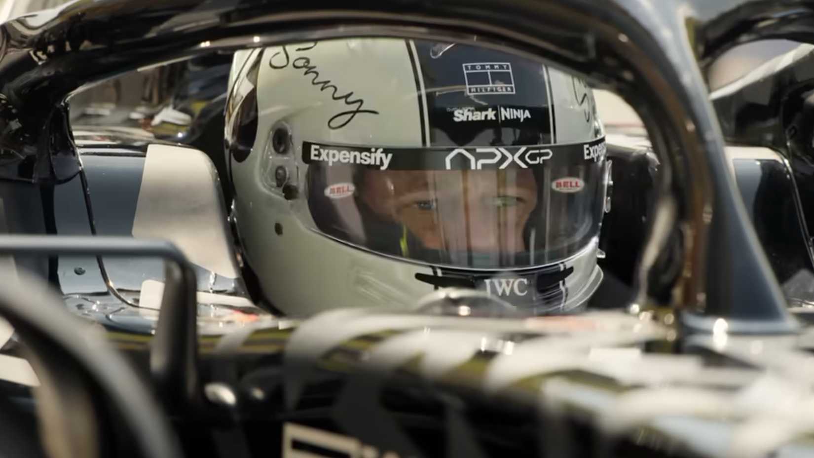 Brad Pitt as Sonny Hayes in a car in the F1 movie