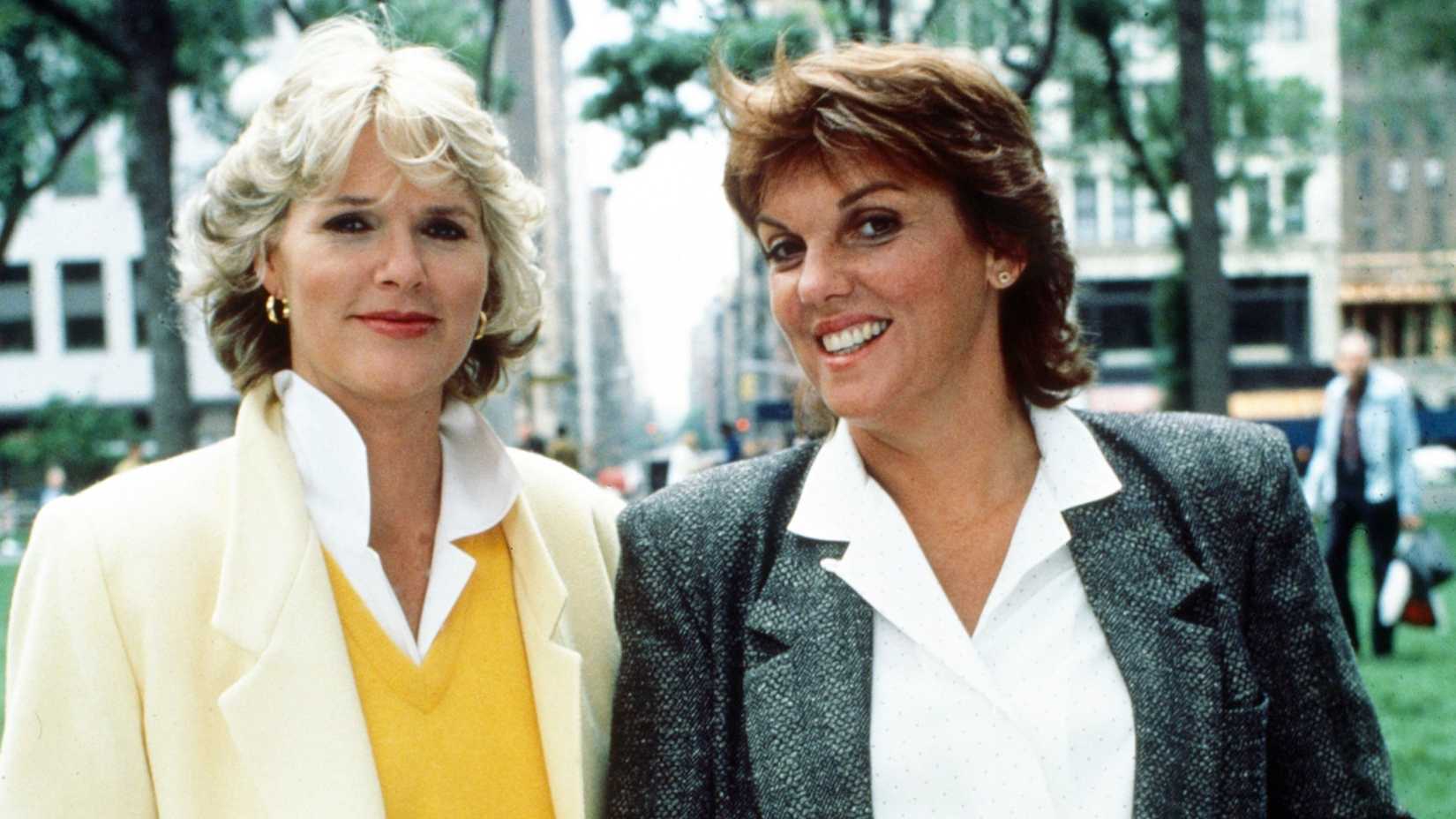 Christine Gless (Christine Cagney) and Beth Lacey (Tyne Daly) smiling next to one another in Cagney & Lacey.