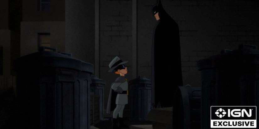 carrie kelley wears the gray ghost costume while looking up at batman in batman caped crusader season 2