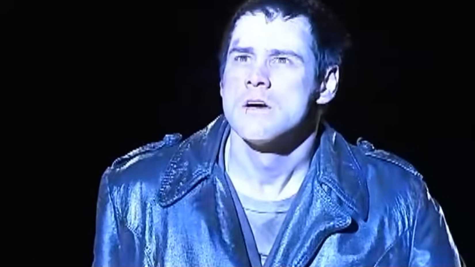 Chip (Jim Carrey) in a police helicopter spotlight in The Cable Guy