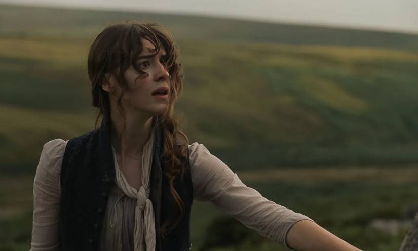 Daisy Edgar Jones against green field in Sense & Sensibility