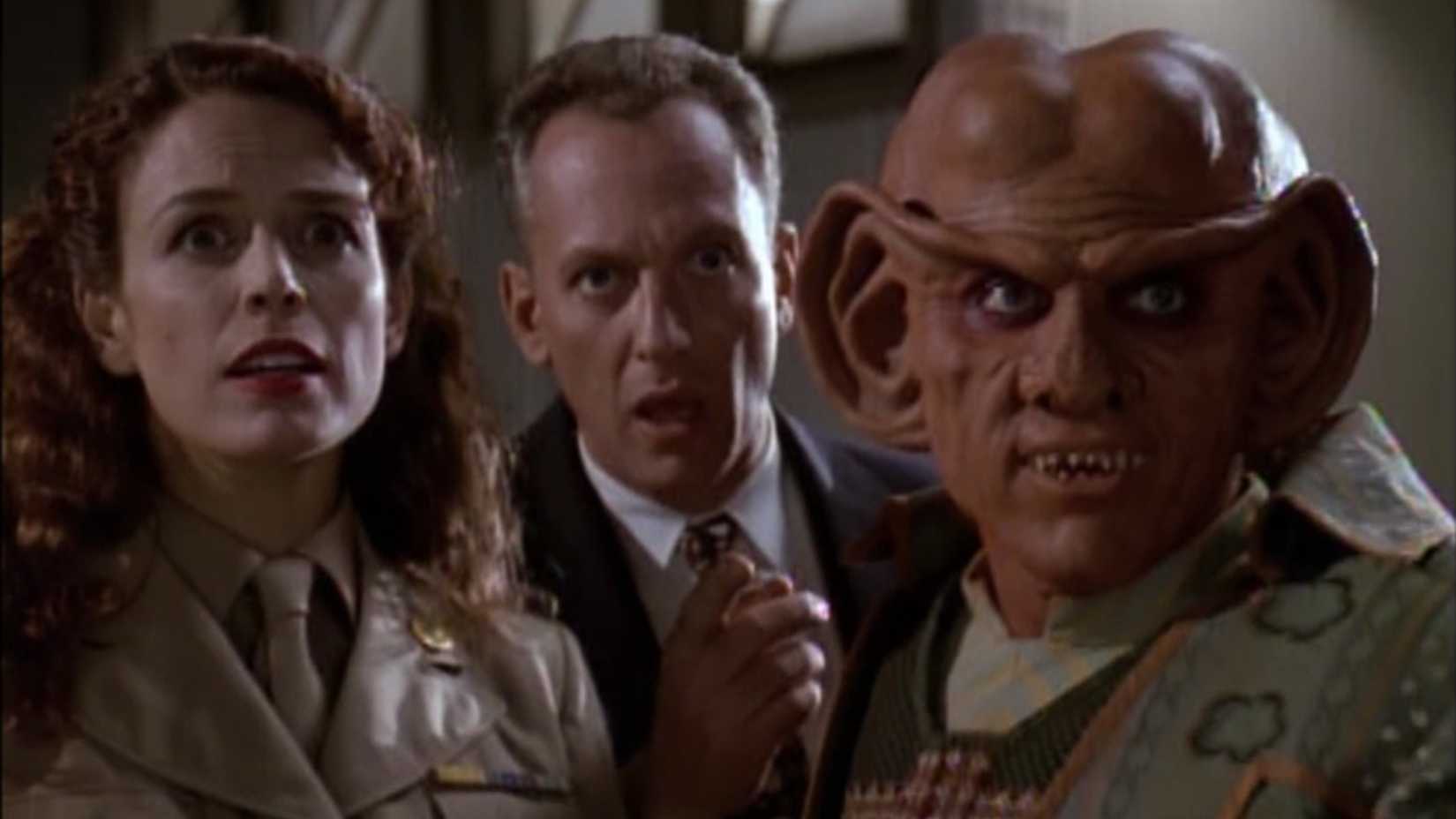 Quark and the humans look on in the Deep Space Nine episode "Little Green Men"